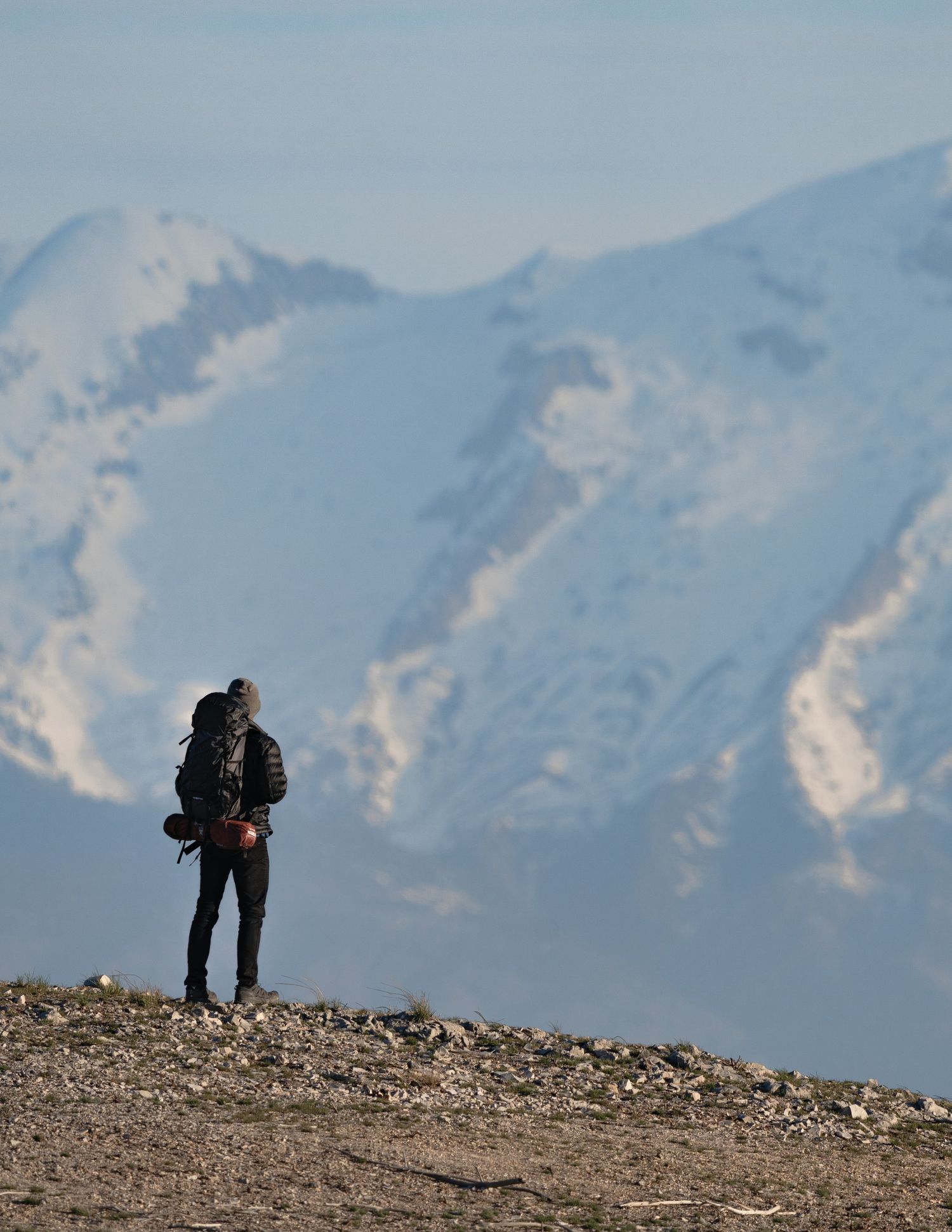 A solitary figure in a vast mountain landscape